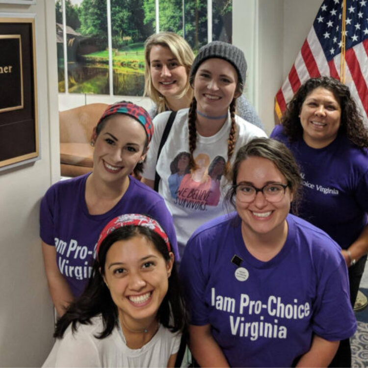 A group of student fellowship advocates in front of an american flag